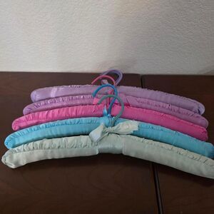 Neiman Marcus multi-colored padded hangers in pastel shades